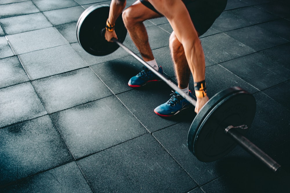 Athlete setting up a barbell deadlift